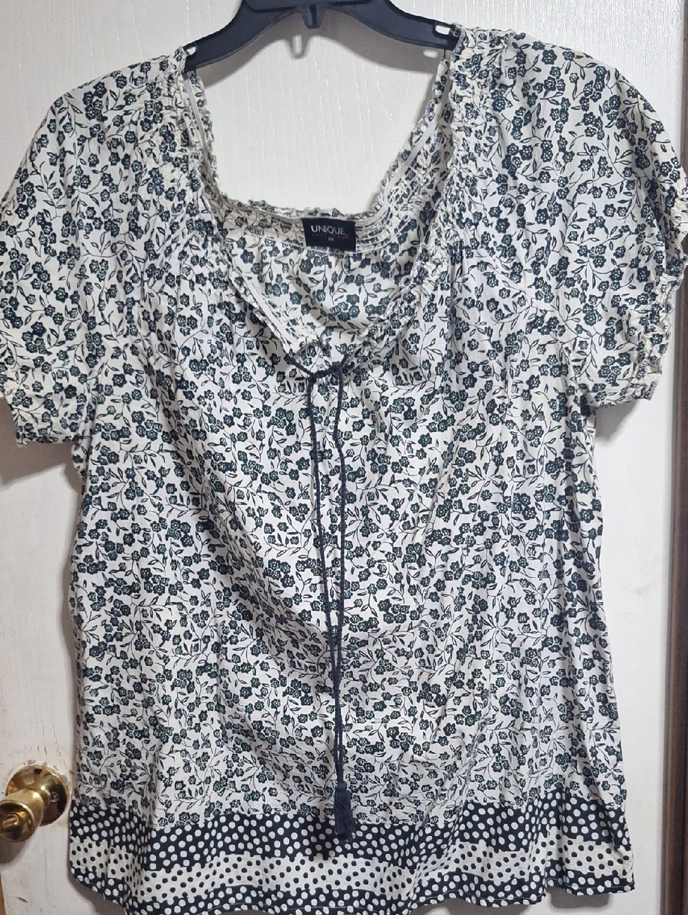 Unique Spectrum Cream and Black Floral Tie-Neck Blouse with Polka Dot Hem